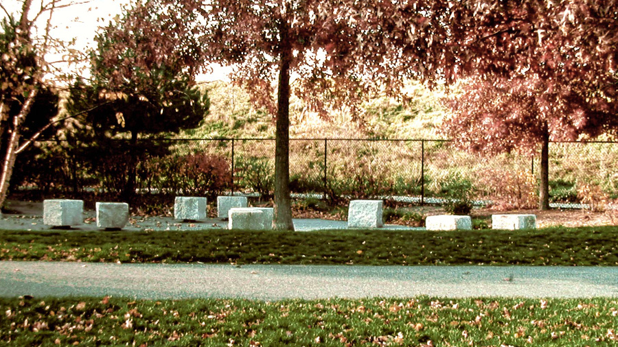 Floating Stones, 1992
Granite with elastomer inserts, plantings (River Birch, Pin Oaks, Red Twig Dogwood, Fragrant Sumac, Day Lilies), pavers, gravel.
Eleven 3' sq. blocks, 1800 sq. foot area.